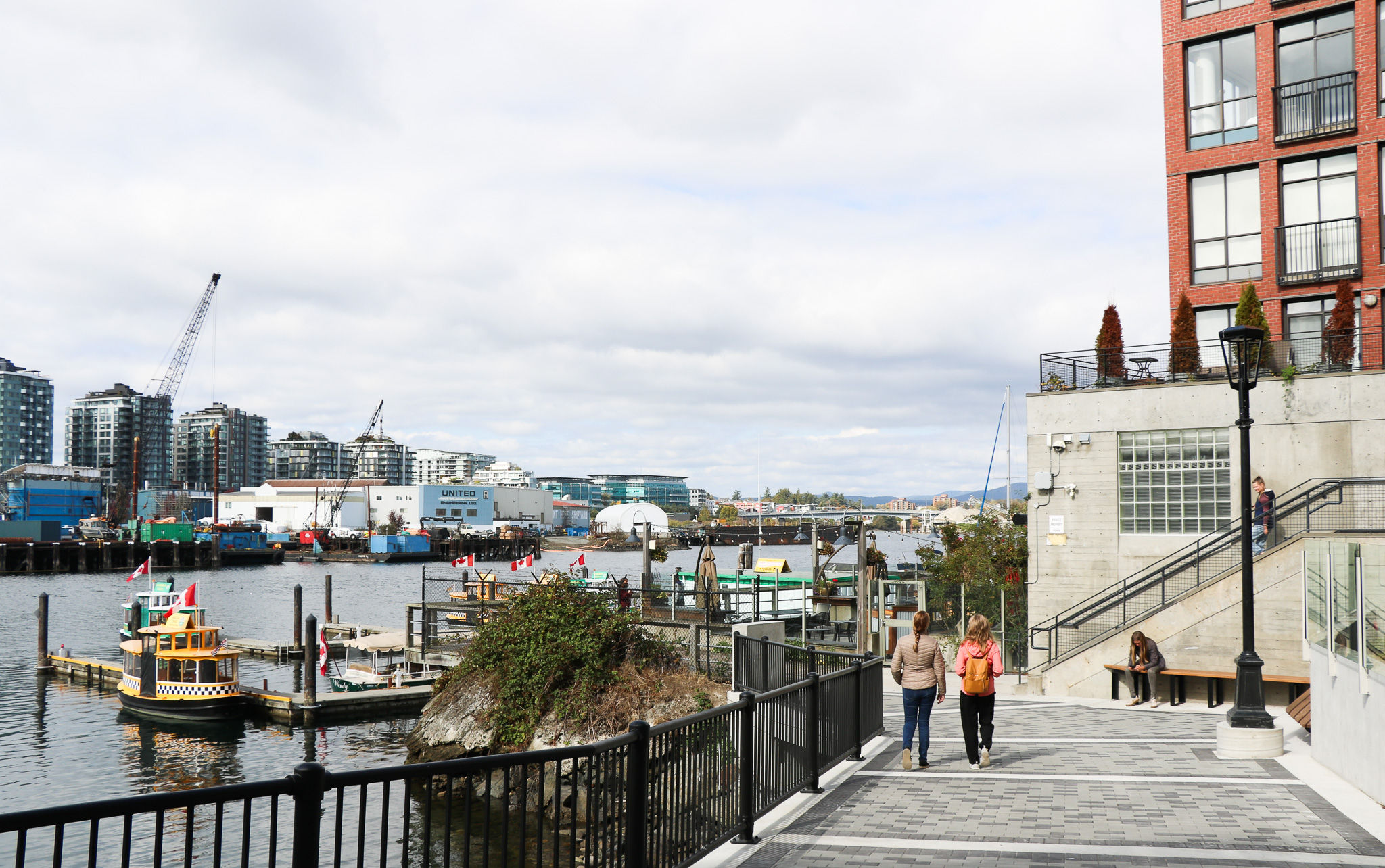 cyclists using a bike path near the harbour in victoria