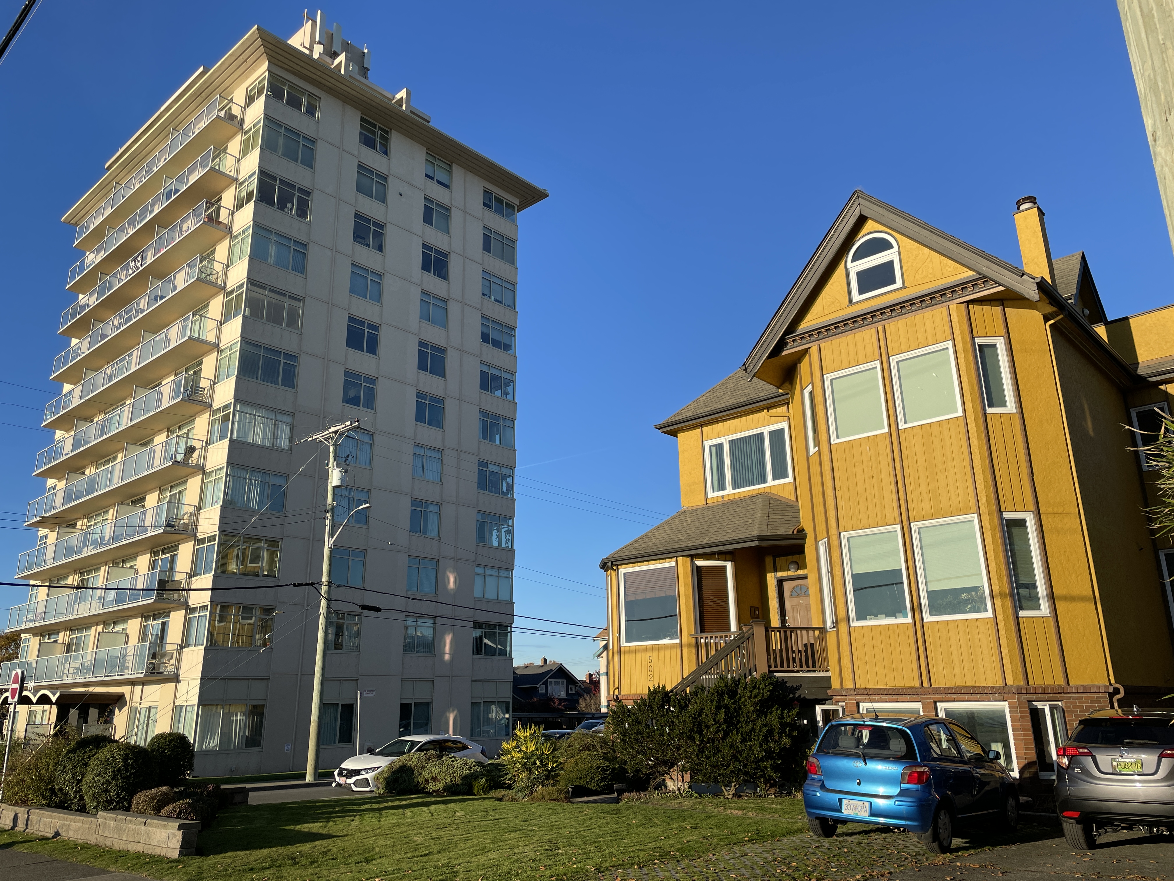 multi-storey apartment building next to a house